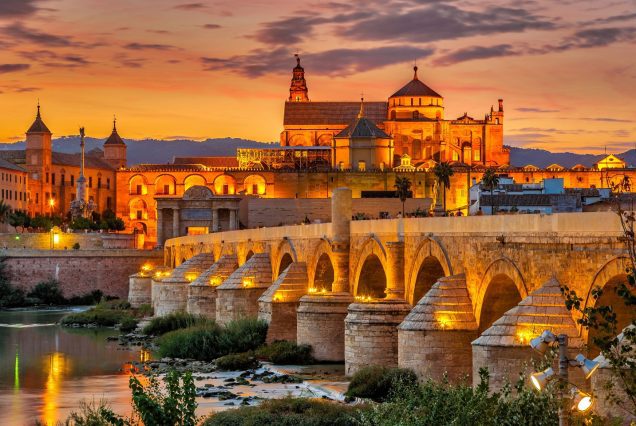 Evening view at the Mosque Cathedral with Roman bridge in Cordoba Spain