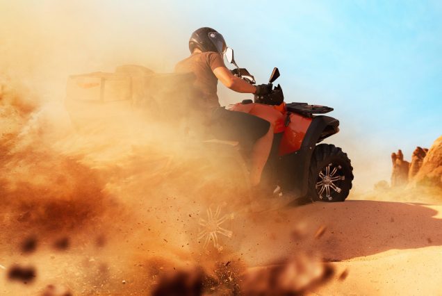 atv riding in sand quarry dust clouds quad bike